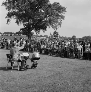 Print of a clown playing drums at Laing Sports Ground