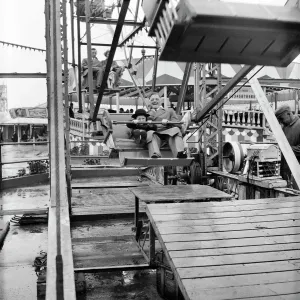 Prints of SKEGNESS, EAST LINDSEY, LINCOLNSHIRE. A man and a child on a Ferris wheel during a Laing staff trip to Skegness South Yorkshire Prints: Print of a man and child on a Ferris wheel at Skegness, 1947