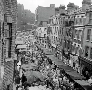 Prints of Petticoat Lane Market, Middlesex Street, Whitechapel, London. 1950s street scene taken from an upper floor window Middlesex Prints: Print of Petticoat Lane Market street scene