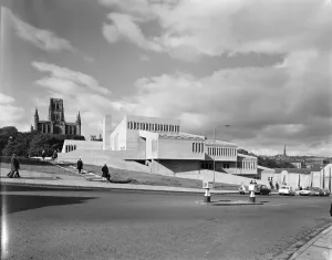Prints of Durham University, Dunelm House, New Elvet, Durham, County Durham. Dunelm House at Durham University seen from south-east with Durham Cathedral in the background Brutalist Architecture Prints: Durham University Students Union Print, Dunelm House