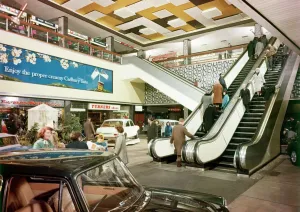 Prints of Interior view of the Bull Ring Shopping Centre, Birmingham, showing escalators and people shopping, c. 1964. John Laing Collection Industry and Agriculture in England - Factories, Farming and Production: Bull Ring Shopping Centre Print, c. 1964