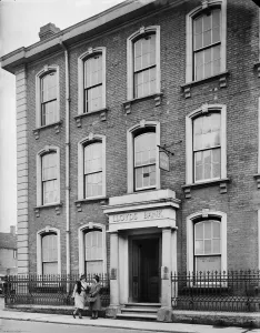 Prints of Lloyds Bank, High Street, Bromsgrove, Worcestershire. Two women chatting on the pavement outside Lloyds Bank at 112 High Street Historic Photos of England - People, Places and Everyday Life: High Street Bromsgrove Print 1941
