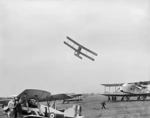 Prints of HENDON, Barnet. An Avro 504 aircraft flying very low over parked aircraft at the RAF Pageant of 1927. The parked aircraft are a Gloster Gamecock Mk.I, Short Springbock II, and Handley Page Hyderabad Historic Images 1920s To 1940s Prints: Avro 504 Low Flyby Print