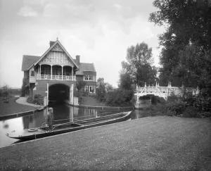 Victorian Architecture - Buildings, Streets and Landmarks: Print of a Thames boathouse with an electric launch