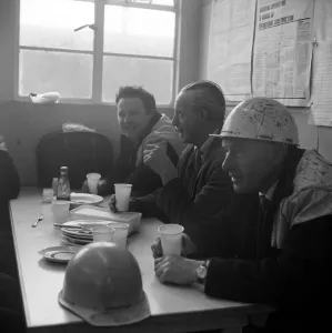 Print of three Laing workmen in a site canteen at Heathrow Airport