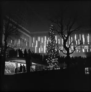 Prints of BULL RING CENTRE, BULL RING, BIRMINGHAM, WEST MIDLANDS. A silhouetted view of a carol service being held on the spiral ramp at the Bull Ring Centre Birmingham Prints: Bull Ring Centre Carol Service Print