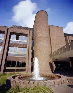 Prints of Sir John Laing Building, Page Street, Mill Hill, Barnet, Greater London. The circular fountain and U-shaped stair tower by the front entrance to the Sir John Laing Building, Mill Hill Brutalist Architecture Prints: Print of a circular fountain and U-shaped stair tower