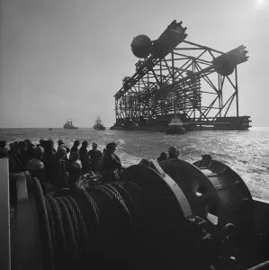 Prints of Graythorp, Hartlepool. A view of the oil platform Graythorp II being floated away from Graythorp, on its journey along the Seaton Channel towards the North Sea Industry and Agriculture in England - Factories, Farming and Production: Oil Platform Graythorp II Print