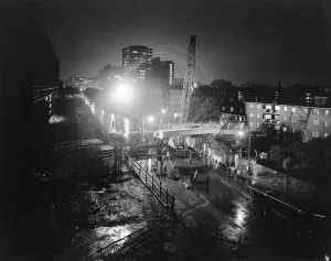 Prints of New Kent Road, Newington, Southwark, Greater London. A 60-tonne Gargantua crane lowering the central section of deck into place during the construction of a footbridge over New Kent Road, Southwark Engineering And Construction Prints: New Kent Road Footbridge Construction Print