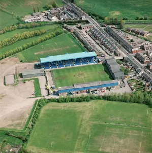 Prints of BRUNTON PARK, Carlisle. Home of Carlisle United Football Club. Photographed in May 1996. Aerofilms Collection (see Links) Cumbria Prints: Aerofilms Print of Brunton Park Stadium
