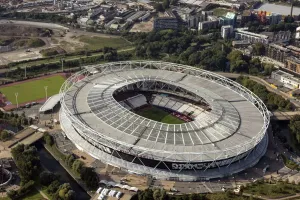 Prints of London Stadium, formerly known as Olympic Stadium and site of 2012 Summer Olympics, now home to West Ham United Football Club, Stratford Marsh, and the ArcelorMittal Orbit, Greater London Authority Sport Prints: London Stadium Print, aerial view of a football stadium