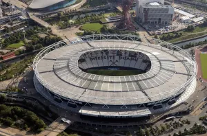 Prints of London Stadium, formerly known as Olympic Stadium and site of 2012 Summer Olympics, now home to West Ham United Football Club, Stratford Marsh, and the ArcelorMittal Orbit, Greater London Authority Greater London Prints: London Stadium Print, a colour photograph of the stadium from above