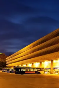 Prints of Preston Bus Station, Tithebarrn Street, Preston. The west elevation illuminated at dusk with buses in bays of the bus station. Photographed in June 2011 Brutalist Architecture Prints: Preston Bus Station Print, West Elevation at Dusk
