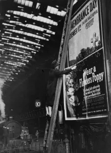 Print of Woman Pasting Poster at Paddington Station, 1943