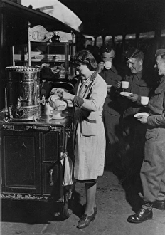 Servicemen drinking tea from a refreshment trolley on Paddington station, during WWII Servicemen drinking tea from a refreshment trolley on Paddington station, during WWII
