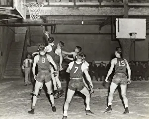 Airmen Playing Basketball in a Gym at the Headquarters o? Airmen Playing Basketball in a Gym at the Headquarters o?