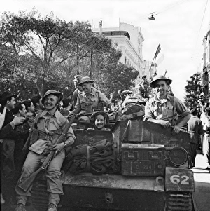 Allied troops being welcomed as they pass through Tunis Allied troops being welcomed as they pass through Tunis