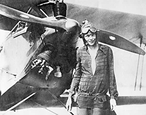 Amelia Earhart, pioneering aviator, with plane Amelia Earhart, pioneering aviator, with plane