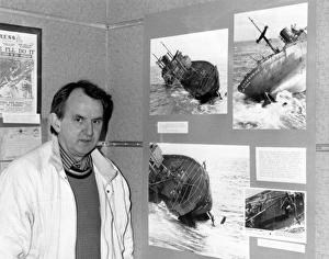Andrew Besley, photographer, at an exhibition Andrew Besley, photographer, at an exhibition