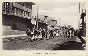 Arab porters in Main Street, Baghdad, Iraq Arab porters in Main Street, Baghdad, Iraq