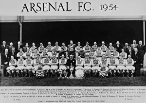 Prints of Arsenal Football Club team and officials, 1954 (names below the photo). The trophies on display are: Combination Cup, Mid-Week League Cup, Football League Cup, FA Charity Shield. Date: 1954 Sport Prints: Arsenal Football Club Team Print 1954