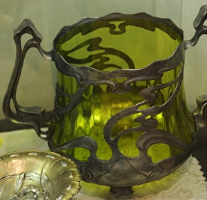 Art nouveau. Showcase with different objects. Early twentiet Art nouveau. Showcase with different objects. Early twentiet