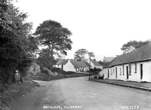 Prints of Articlave, Co. Derry - a rural village scene with thatched buildings and boy to the left. (Location: Northern Ireland; County Londonderry; Articlave). Date: circa early 1900s Derry Prints: Early 20th Century Articlave Print