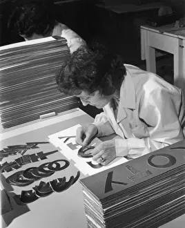 Female Factory Worker Prints: Assembling a Sign