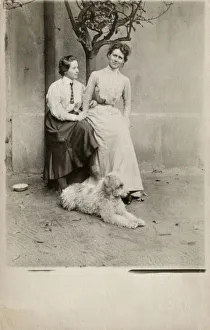 Austrian Mother and Daughter with their shaggy pet dog Austrian Mother and Daughter with their shaggy pet dog