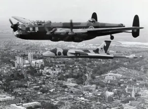Prints of RAF Battle of Britain Memorial Flight Bbmf Avro 683 Lancaster B-1 City of Lincoln and 617 Squadron Avro Vulcan B-2 flying in formation over Lincoln Cathedral, UK Date: 1980s World War I Prints: Avro Lancaster B-1 and Vulcan in Formation Print
