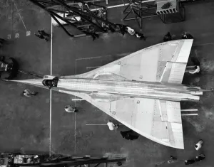 Prints of Bac 221 Supersonic Prototype in 1964 in a Hangar at Filton with Engineers Date: 1964 Aviation Prints: Bac 221 Supersonic Prototype Print, Filton Hangar, 1964
