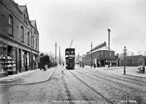 Prints of Ballyhackamore, Belfast - a street scene with a tram, shop fronts, people and horse vehicle. (Location: Northern Ireland: County Antrim: Belfast). Date: circa early 1900s County Antrim Prints: Early 20th Century Belfast Street Scene Print
