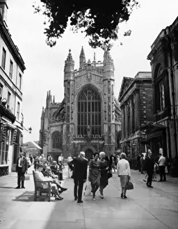 Prints of Visitors outside Bath Abbey, Bath, Somerset, England. Date: 12th century Norman Architecture Prints: Bath Abbey Visitors Print, Somerset, England