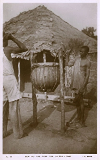 Beating the tom-tom, Sierra Leone, West Africa Beating the tom-tom, Sierra Leone, West Africa