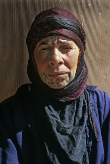 Bedouin woman with face tattoos outside her tent, Syria Bedouin woman with face tattoos outside her tent, Syria