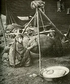 Bedouin women making butter in a goatskin, Arabia Bedouin women making butter in a goatskin, Arabia