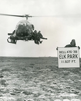Bell Model 47G-3B hovers at Elk Park with eight men aboard Bell Model 47G-3B hovers at Elk Park with eight men aboard