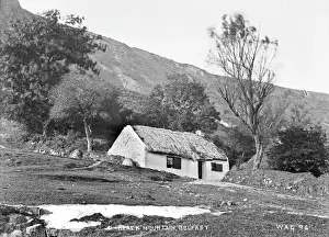 Prints of Black Mountain, Belfast - with thatched cottage in foreground. (Location: Northern Ireland: County Antrim: Belfast). Date: circa early 1900s County Antrim Prints: Black Mountain, Belfast Print: Early 20th Century