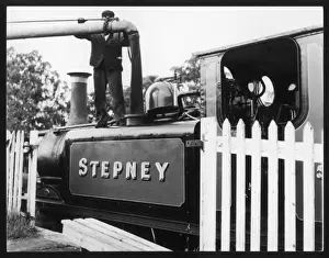 Prints of The locomotive Stepney taking on water at the Bluebell Railway, Sheffield Park, Sussex, England Railway Prints: Bluebell Railway Print: Stepney at Sheffield Park Watering Stop