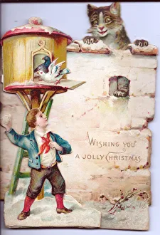 Boy with cat and birds on a cutout Christmas card Boy with cat and birds on a cutout Christmas card