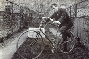 Boy getting on to his new Bicycle Boy getting on to his new Bicycle