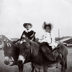 Boy and girl on donkeys, Saltburn, North Yorkshire Boy and girl on donkeys, Saltburn, North Yorkshire
