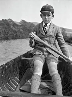 Boy in School Uniform Rowing a Boat Print, circa 1920s