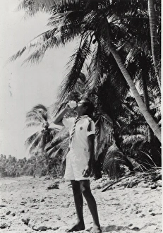 Boy scout on a beach, Gilbert Islands, Pacific Boy scout on a beach, Gilbert Islands, Pacific