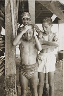 Boy scouts sharing a shower at camp, British Honduras Boy scouts sharing a shower at camp, British Honduras