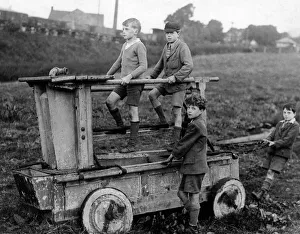 Boys on an 18th century fire engine, Wirksworth Boys on an 18th century fire engine, Wirksworth