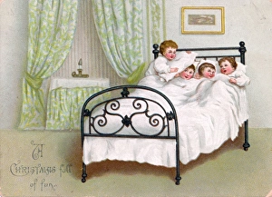Four boys in bed on a Christmas card Four boys in bed on a Christmas card