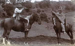 Two boys on horseback playing Cowboys and Indians Two boys on horseback playing Cowboys and Indians