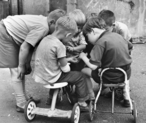 Boys with tricycles in a Balham street, SW London Boys with tricycles in a Balham street, SW London