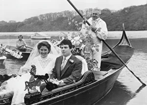 Bride and groom in a gondola, Malpas, Cornwall Bride and groom in a gondola, Malpas, Cornwall